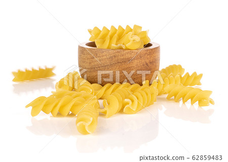 Yellow fusilli pasta isolated on white Yellow fusilli pasta isolated on white 62859483