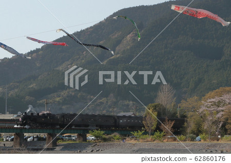Oigawa Railway SL train crossing the Oi River with carp streamers Oigawa Railway SL train crossing the Oi River with carp streamers 62860176