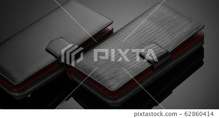 men's wallet on a black background 62860414