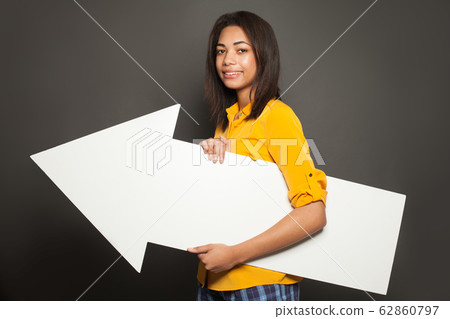 Happy african american woman holding white empty Happy african american woman holding white empty 62860797