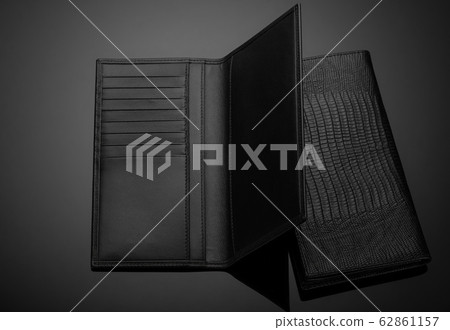 men's wallet on a black background 62861157