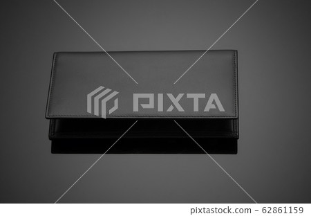 men's wallet on a black background 62861159
