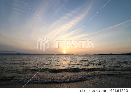 Lake Inawashiro and the setting sun of March 1, 2020 seen from Shidahama Lake Inawashiro and the setting sun of March 1, 2020 seen from Shidahama 62861260