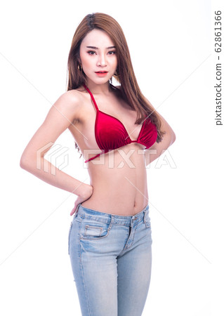 Cute asian woman in red bikini and jeans isolated - Stock Photo