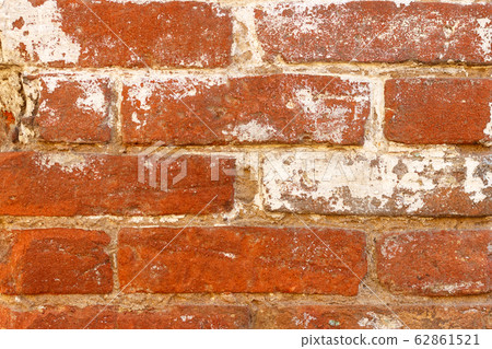 Brick wall made of old red brick. 62861521