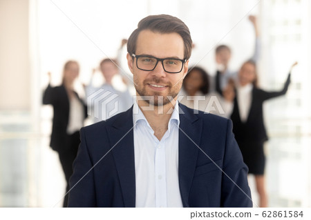 Close up portrait smiling millennial businessman in office. 62861584