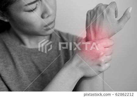 Woman suffering from pain in wrist. Woman suffering from pain in wrist. 62862212