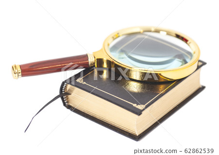 Book with magnifying glass over white background Book with magnifying glass over white background 62862539
