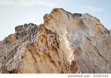 Cliffs by the sea. 62863323