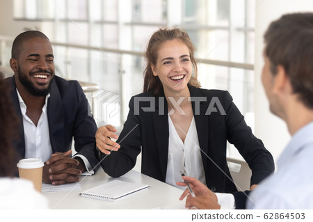 Happy laughing black man and woman break in business negotiations 62864503