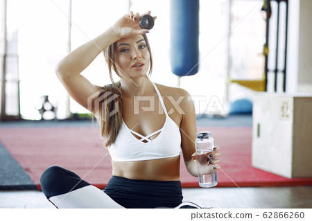 Sports girl training in a morning gym Sports girl training in a morning gym 62866260