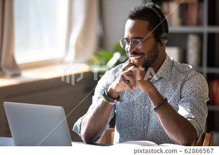 Smiling biracial businessman holding video call with clients partners. 62866567