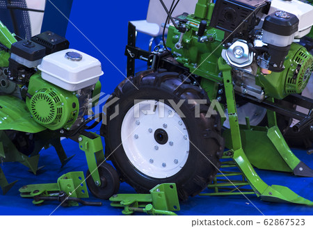 Green lawn mower on grass Green lawn mower on grass 62867523