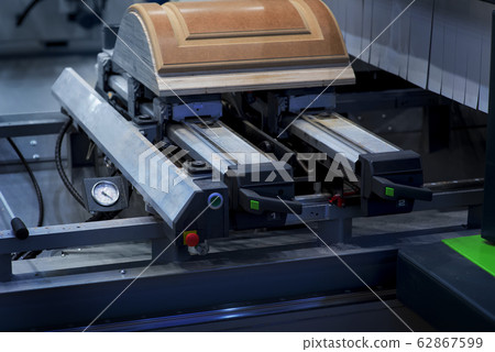 Wood milling machine in action close up process 62867599