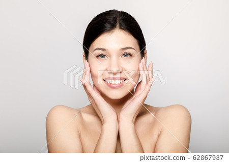 Brunette Beauty Touching Her Soft Face Skin Brunette Beauty Touching Her Soft Face Skin 62867987
