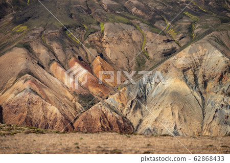 Landmannalaugar Colorful mountains on the Laugavegur hiking trail. Iceland. The combination of Landmannalaugar Colorful mountains on the Laugavegur hiking trail. Iceland. The combination of 62868433