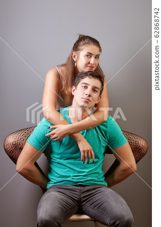 Lovely white woman hugs her man. Lovely white woman hugs her man. 62868742