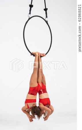 Twins female circus duo on the Aerial hoop isolated on white 62868821
