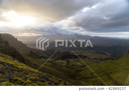 Canyon and Mountain peak during dramatic and colorful sunset on the Fimmvorduhals Hiking trail near 62869237