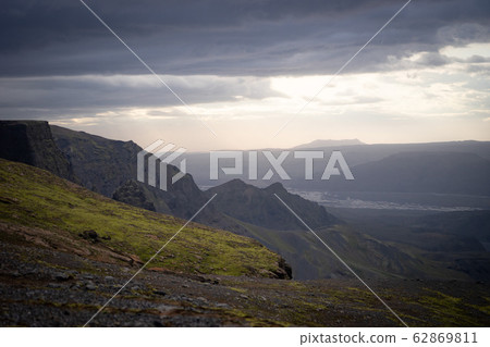 Canyon and Mountain peak during dramatic and colorful sunset on the Fimmvorduhals Hiking trail near 62869811
