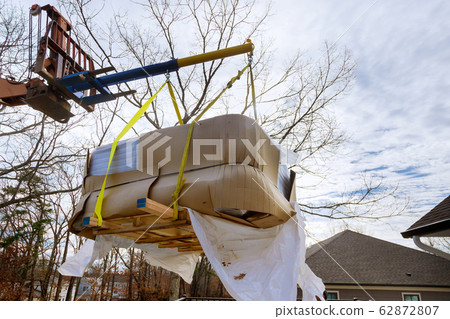Lifting Boom Lift in modern jacuzi are lifting by Lifting Boom Lift in modern jacuzi are lifting by 62872807