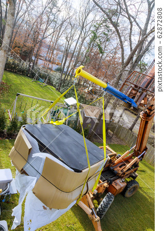 Hydraulic boom truck lifting a with risen Hydraulic boom truck lifting a with risen 62872808