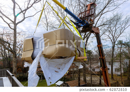 Scale weight above blue sky industrial crane Scale weight above blue sky industrial crane 62872810