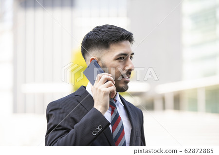 Businessmen using smartphones Businessmen using smartphones 62872885