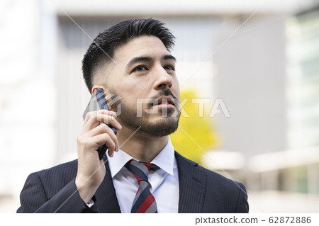 Businessmen using smartphones Businessmen using smartphones 62872886