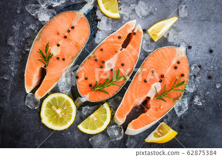 Fresh salmon steak with herbs and spices lemon Fresh salmon steak with herbs and spices lemon 62875384