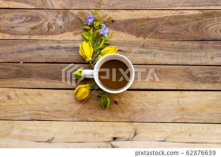 hot coffee with yellow flowers ylang ylang  of lifestyle 62876639