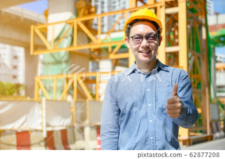 New generation of asian engineers are working on the construction site New generation of asian engineers are working on the construction site 62877208