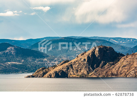 Scenery view of rocky slope over the lake in British Columbia. Scenery view of rocky slope over the lake in British Columbia. 62878738