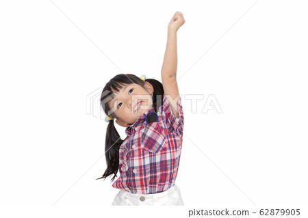 A young girl raising her fist with a smile cheerfully. Cheerful, guts pose, health image 62879905