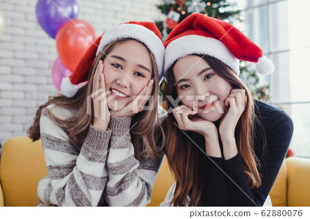Portrait of two young Asian women dressing up for 62880076