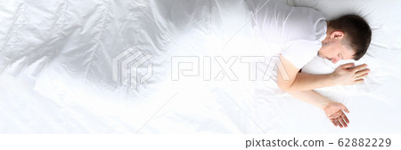 Young caucasian beauty woman sleeping on white bed Young caucasian beauty woman sleeping on white bed 62882229