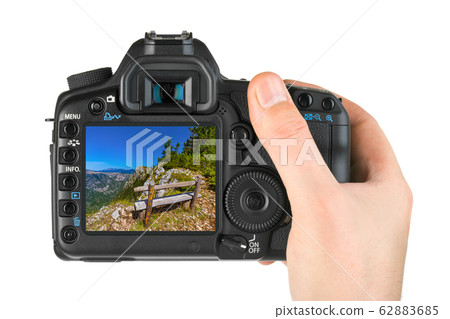 Hand with camera and River Tara canyon - 62883685