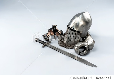 Knight's metal helmet isolated on white background. Knight's metal helmet isolated on white background. 62884631