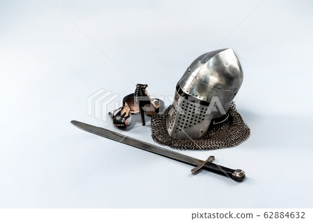 Knight's metal helmet isolated on white background. 62884632