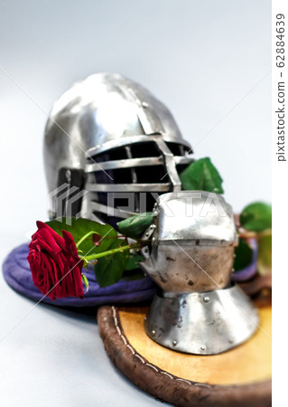 Knight's metal helmet isolated on white background. Knight's metal helmet isolated on white background. 62884639