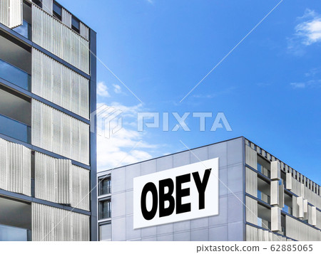 Modern building with message "Obey" Modern building with message "Obey" 62885065