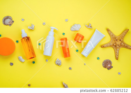 Frame from sunscreens. Flat lay, natural cosmetics, cream with SPF. Concept Prevention of photoaging Frame from sunscreens. Flat lay, natural cosmetics, cream with SPF. Concept Prevention of photoaging 62885212