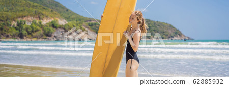 Beuatiful surfer girl making preparation for a surf session BANNER, LONG FORMAT 62885932