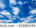 blue sky and white clouds 62886349