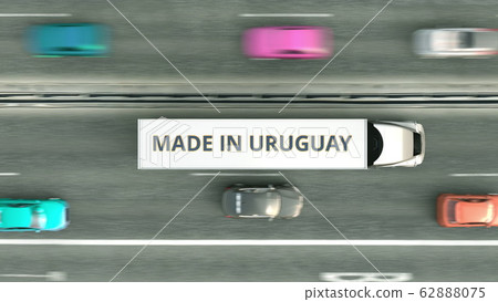 Aerial overhead view of semi-trailer truck with MADE IN URUGUAY text driving along the highway. Uruguayan business related 3D rendering Aerial overhead view of semi-trailer truck with MADE IN URUGUAY text driving along the highway. Uruguayan business related 3D rendering 62888075