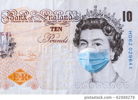 10 pounds banknote . The concept of epidemic and protection against coronavrius. 10 pounds banknote . The concept of epidemic and protection against coronavrius. 62888278