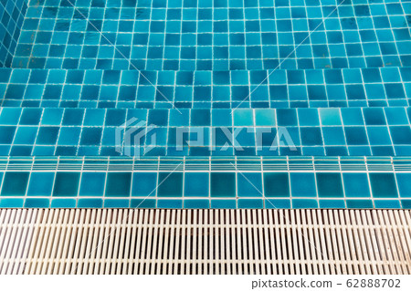 Swimming Pool.swimming pool bottom caustics ripple and flow with waves background.Swimming pool of luxury hotel. 62888702
