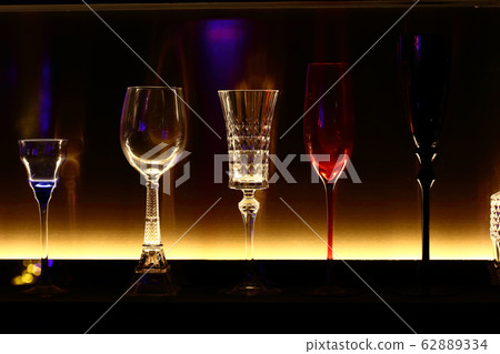 empty bottles and wine glass decorative on backlit empty bottles and wine glass decorative on backlit 62889334