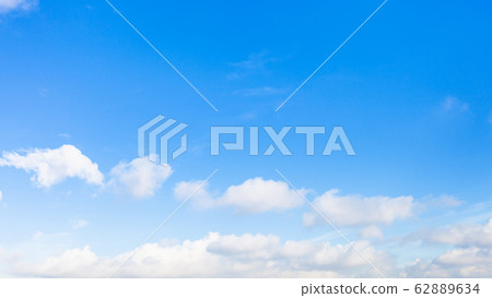 panoramic view of chain of clouds in blue sky panoramic view of chain of clouds in blue sky 62889634