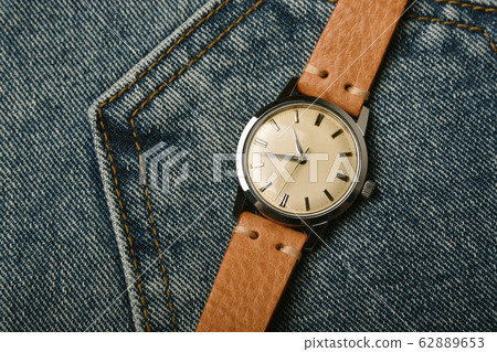 Vintage wristwatch with luxury italian leather strap and brown trendy oxford shoes. 62889653